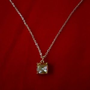 Champagne color stone charm necklace.